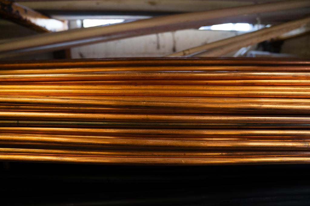 stack of copper pipes